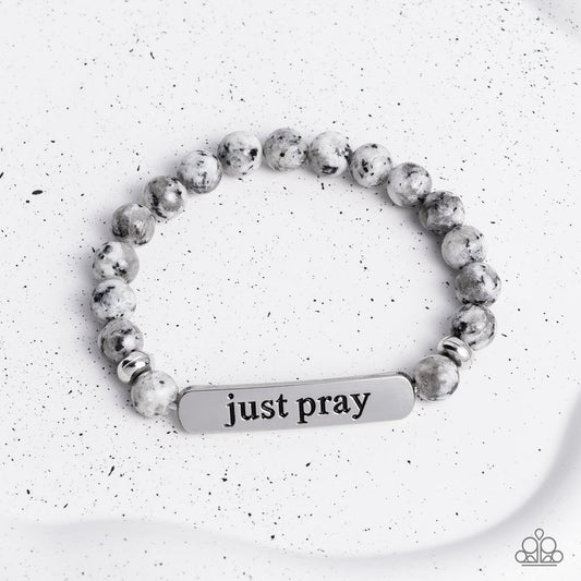 Just Pray - Silver and Gray Stone Bracelet - Paparazzi Accessories - Smooth, gray speckled stones are stretched across the wrist on an elastic stretchy band, with accents of silver beads sprinkled in. Meeting in the center of the stony display, a curved rectangular bar is stamped with the phrase "just pray" for an inspiring finish. As the stone elements in this piece are natural, some color variation is normal. Sold as one individual bracelet.