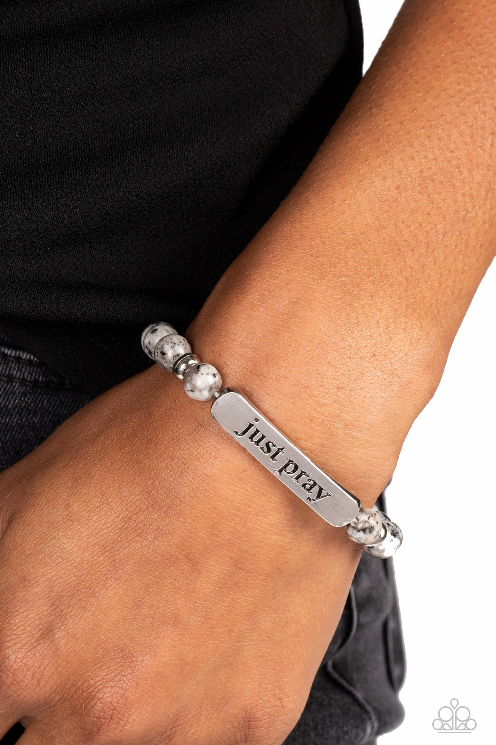 Just Pray - Silver - Gray Stone Bracelet - Paparazzi Accessories - Smooth, gray speckled stones are stretched across the wrist on an elastic stretchy band, with accents of silver beads sprinkled in. Meeting in the center of the stony display, a curved rectangular bar is stamped with the phrase "just pray" for an inspiring finish. As the stone elements in this piece are natural, some color variation is normal. Sold as one individual bracelet.