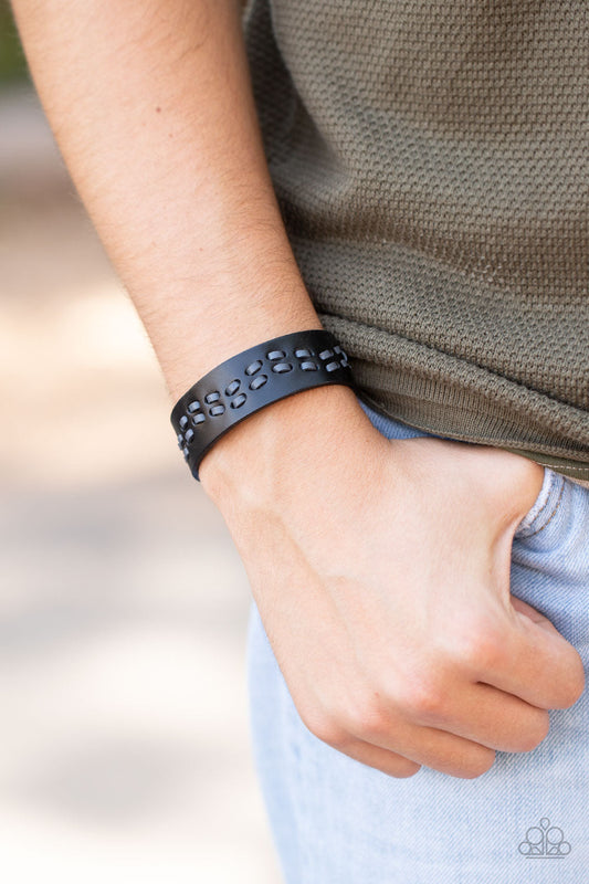 Leather Is My Favorite Color - Black Urban Bracelet - Paparazzi Accessories - Black leather cording is haphazardly laced through the center of a black leather band, creating a rustic look around the wrist. Features an adjustable snap closure. Sold as one individual bracelet.