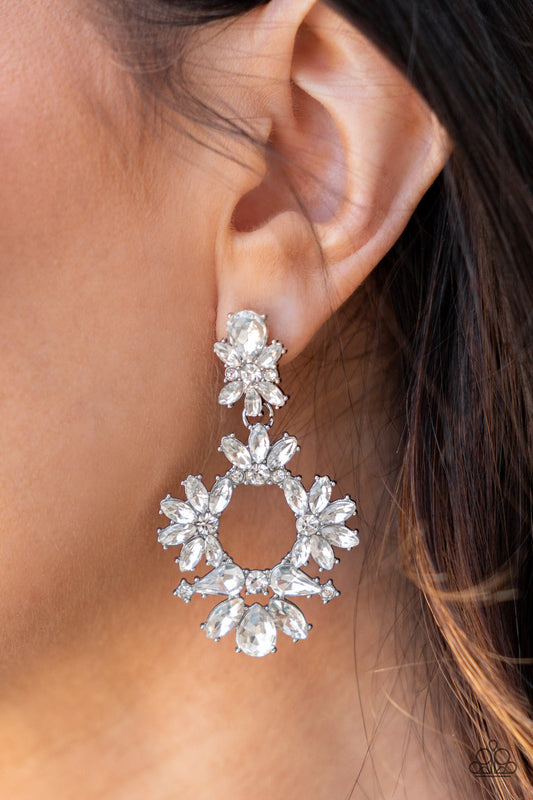 Leave them Speechless - White and Silver Dazzling Earrings - Paparazzi Accessories - Ablaze with a mismatched assortment of brilliant white rhinestones, a stunning wreath swings from the bottom of a dainty white rhinestone fitting for a jaw-dropping dazzle fashion earrings.
