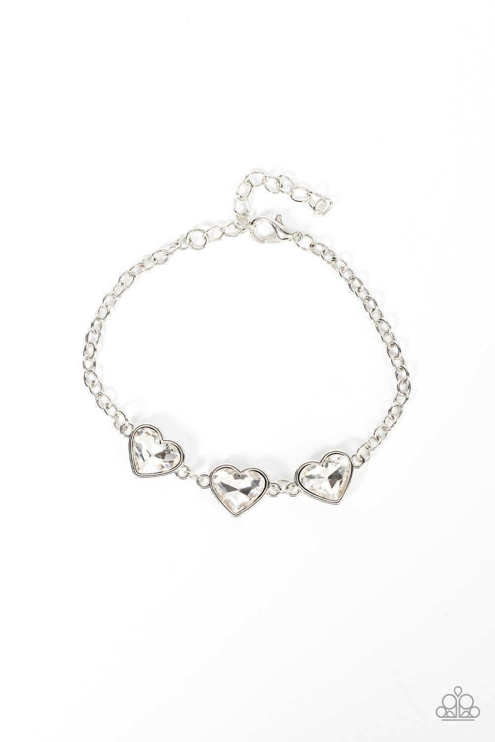 Little Heartbreaker - White Heart Shape Gems - Silver Bracelet - Paparazzi Accessories - Nestled in silver frames, a trio of glittery white heart-shaped gems delicately links across the wrist for a dash of swoon-worthy shimmer. Features an adjustable clasp closure. Sold as one individual fashion bracelet.