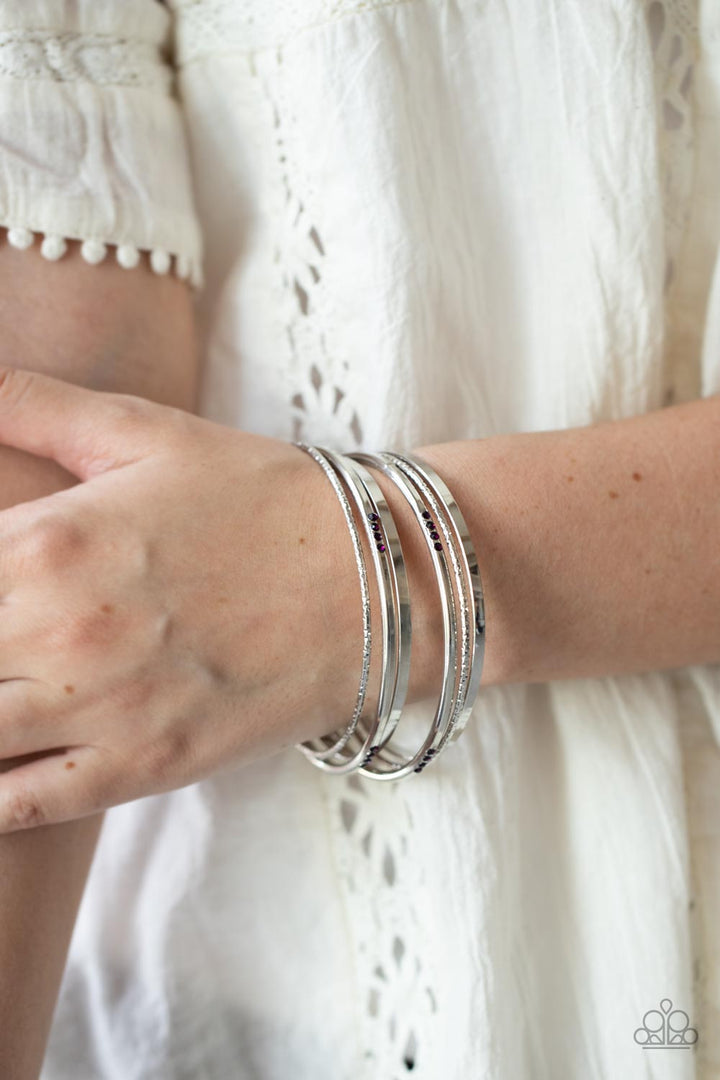 Lock, STACK, and Barrel - Purple and Silver Bangles Bracelet - Paparazzi Accessories - Sections of glittery purple rhinestones, a mismatched collection of sparkly, smooth, and textured silver bangles stylishly stack up the wrist.