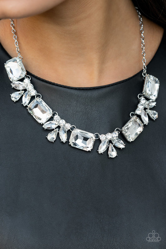 Long Live Sparkle - White Gem and Silver Necklace - Paparazzi Accessories - An oversized collection of white emerald cut gems and regally cut clusters of rhinestones delicately link below the collar, creating a dramatically sparkly fringe. Features an adjustable clasp closure. Sold as one individual necklace.