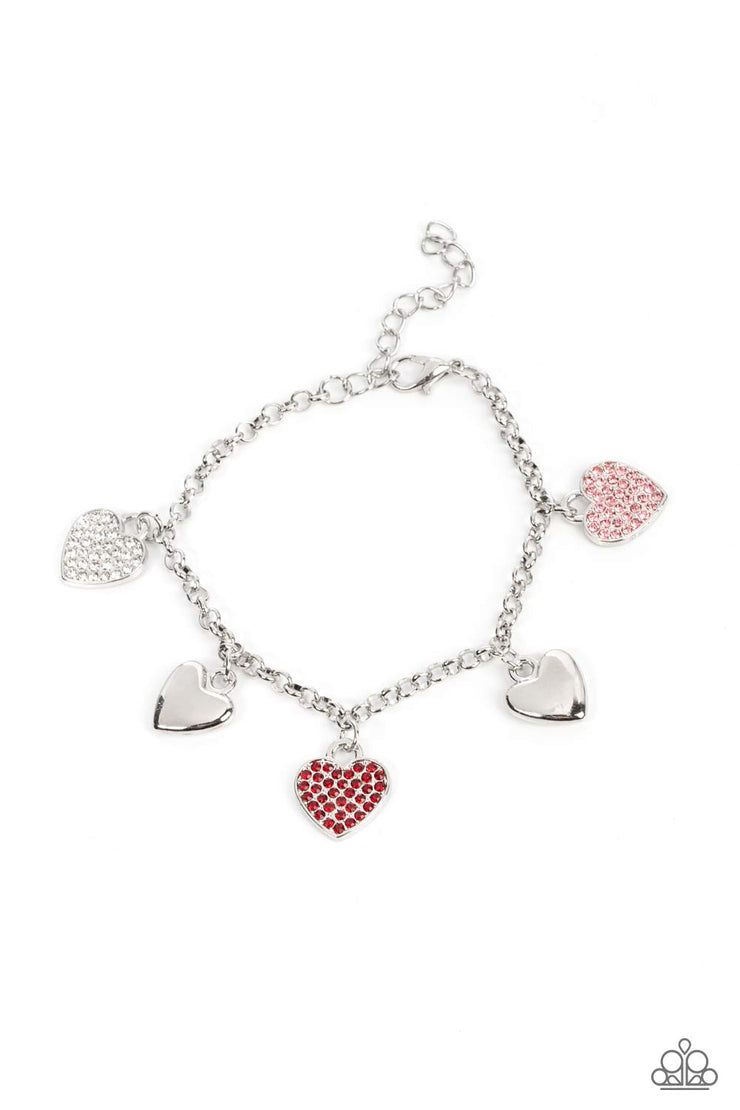 Lusty Lockets - White - Red - Pink Heart Charm - Silver Stylish Fashion Bracelet - Paparazzi Accessories - Shiny silver heart charms delicately alternate with white, red, and pink rhinestone encrusted heart frames along a silver chain around the wrist, resulting in a flirtatious fringe. Features an adjustable clasp closure. Sold as one individual bracelet.