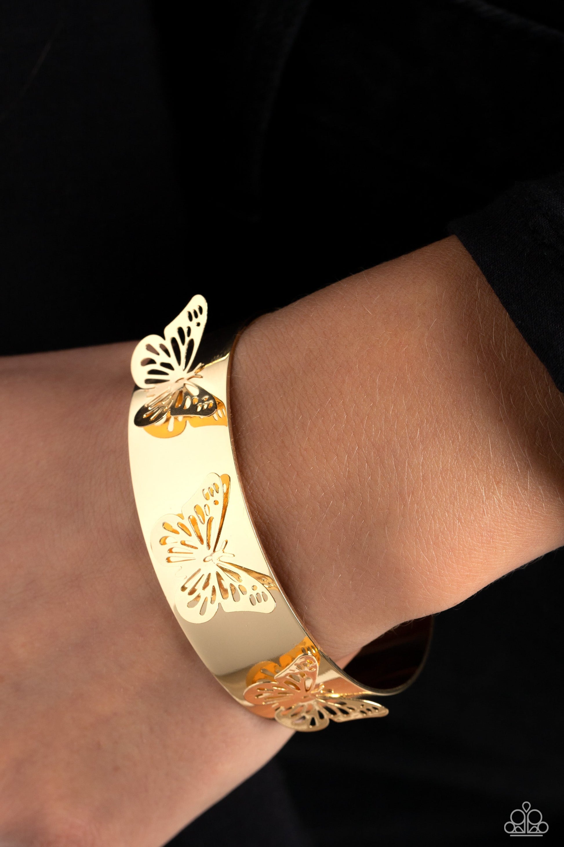 Magical Mariposas - Gold Butterfly Bracelet - Paparazzi Accessories - Three shimmery gold butterflies flutter atop the wrist on a thick gold cuff for a whimsical finish. Sold as one individual bracelet.