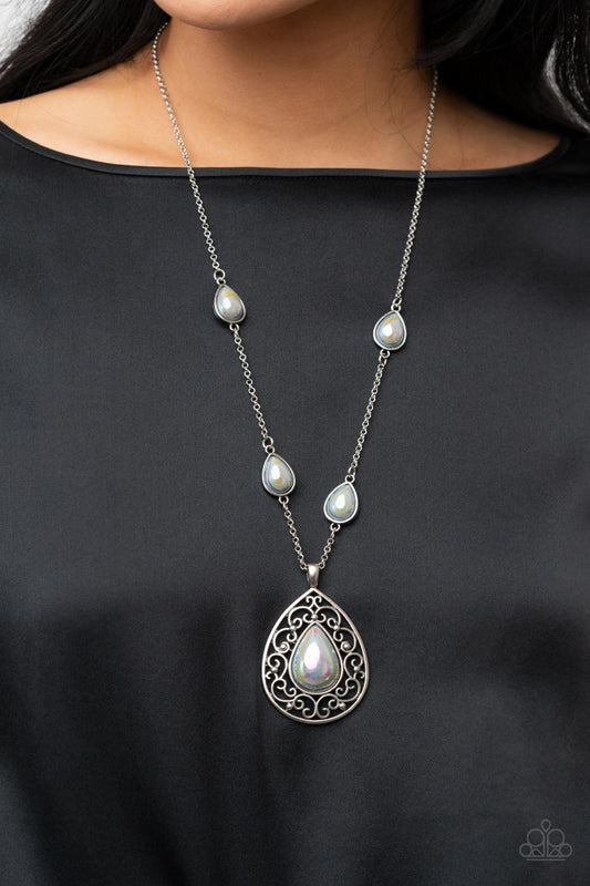 Magical Masquerade - Silver Iridescent Necklace - Paparazzi Accessories - Brushed in an iridescent finish, a silvery teardrop bead is pressed into the center of an oversized silver teardrop frame with vine-like filigree. Infused with matching teardrop beaded frames, the pendant glides along the beaded silver chain for a magical finish. Features an adjustable clasp closure.