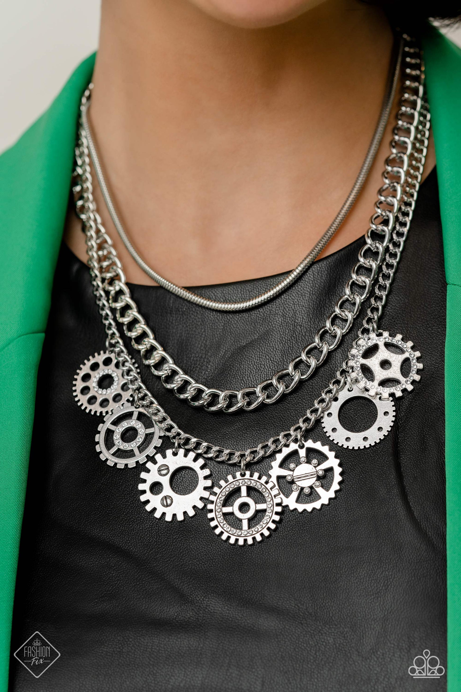 Magnificent Musings - Silver Jewelry Set - Paparazzi Accessories - Gear pendants with varying textures, details, sizes, and a dusting of white rhinestones, swing from a thick silver curb chain, creating a steampunk-like fringe. A silver snake chain and an additional silver curb chain combine with the grungy, industrial display for additional sheen and attitude.
