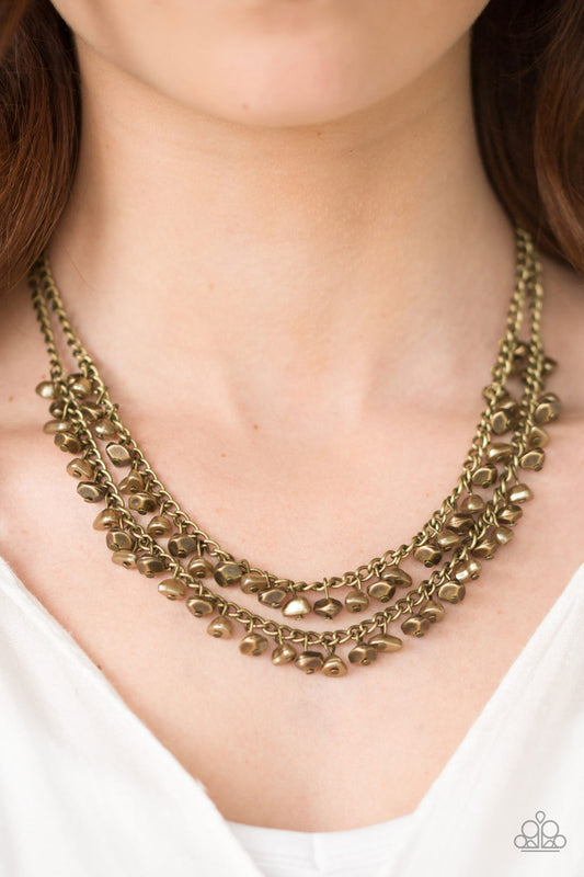 Majestic Marinas - Brass Necklace - Paparazzi Accessories - Brass and pearly brass beads swing from the bottom of two brass chains, creating a refined fringe below the collar. Features an adjustable clasp closure.