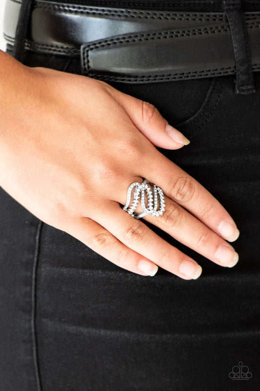 Make Waves - White - Silver Ring - Paparazzi Accessories - Encrusted in dainty white rhinestones, radiant silver ribbons wave across the finger, coalescing into a whimsical band. Features a stretchy band for a flexible fit. Sold as one individual ring.