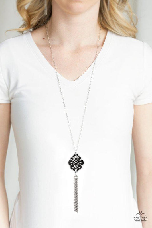 Malibu Mandala - Black and Silver Necklace - Paparazzi Accessories - Shimmery silver filigree swirls across a shiny black backdrop, coalescing into a colorful pendant. A glistening silver chain tassel swings from the bottom of the pendant for a whimsical fashion necklace. Bejeweled Accessories By Kristie - Trendy fashion jewelry for everyone -