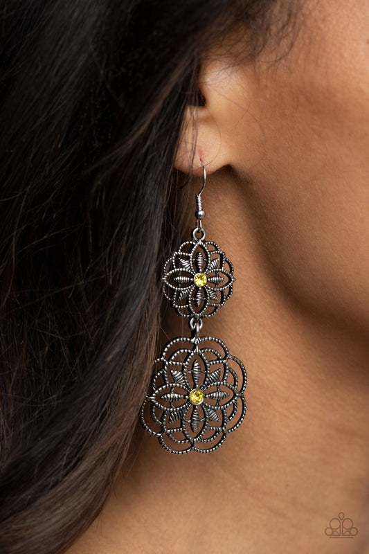 Mandala Mecca - Yellow and Silver Earrings - Paparazzi Accessories - Dotted with dainty yellow rhinestone centers, studded mandala-like silver frames connect into a whimsical floral lure. Earring attaches to a standard fishhook fitting. Sold as one pair of earrings.