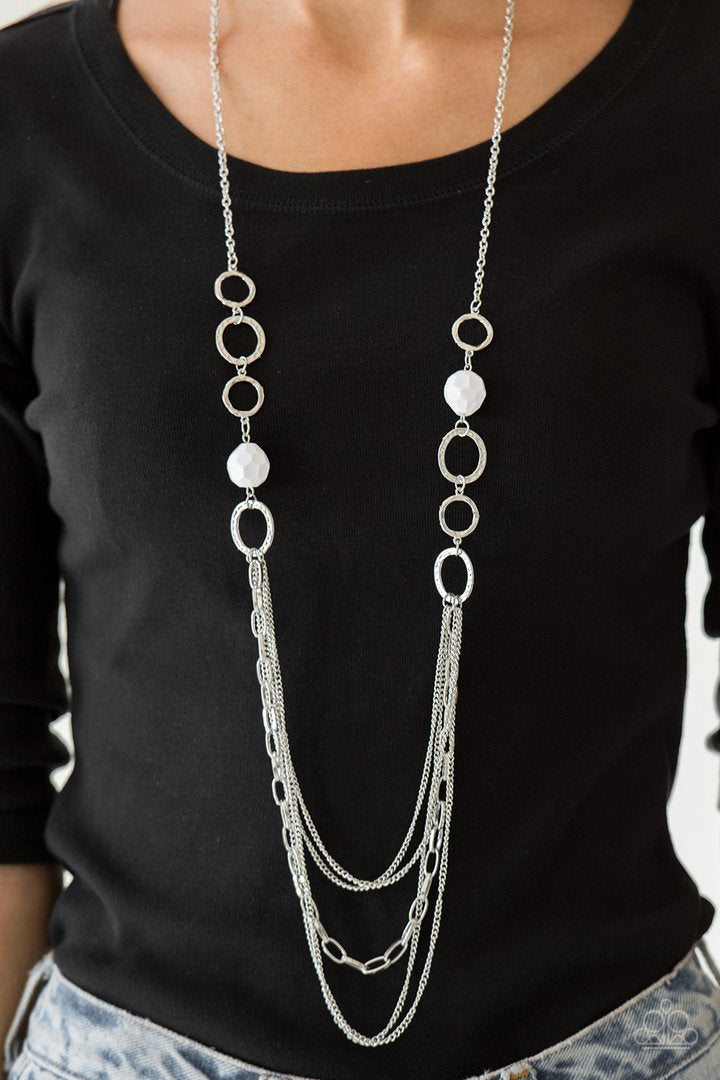 Margarita Masquerades - White and Silver Necklace - Paparazzi Accessories - Faceted white beads and hammered silver hoops give way to layers of mismatched silver chains for a whimsical look. Features an adjustable clasp closure. Sold as one individual necklace.