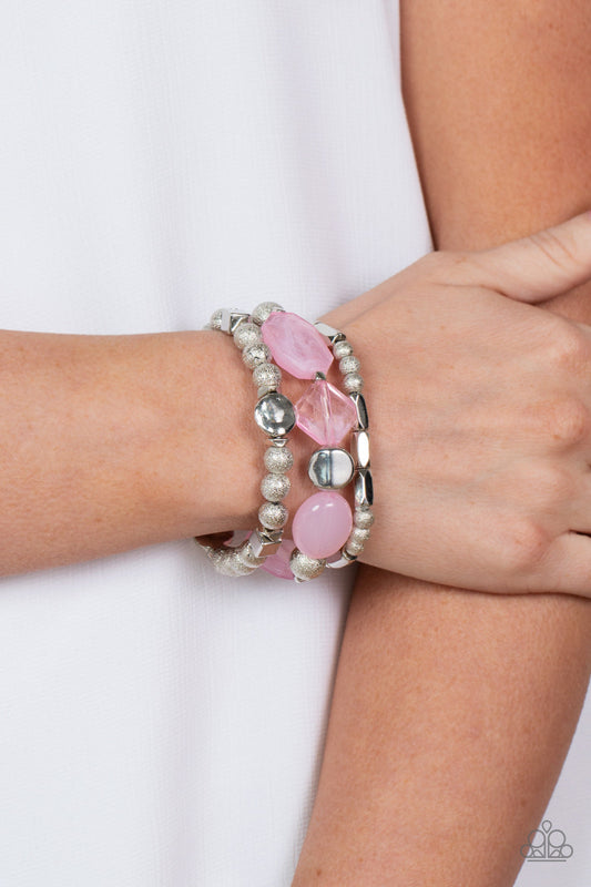 Marina Magic - Pink and Silver Stretchy Fashion Bracelets - Paparazzi Accessories - Infused with enchanting pops of Pale Rosette crystal-like and glassy accents, a mismatched assortment of hammered, cube, and faceted silver beads are threaded along stretchy bands around the wrist, creating shimmery layers.
