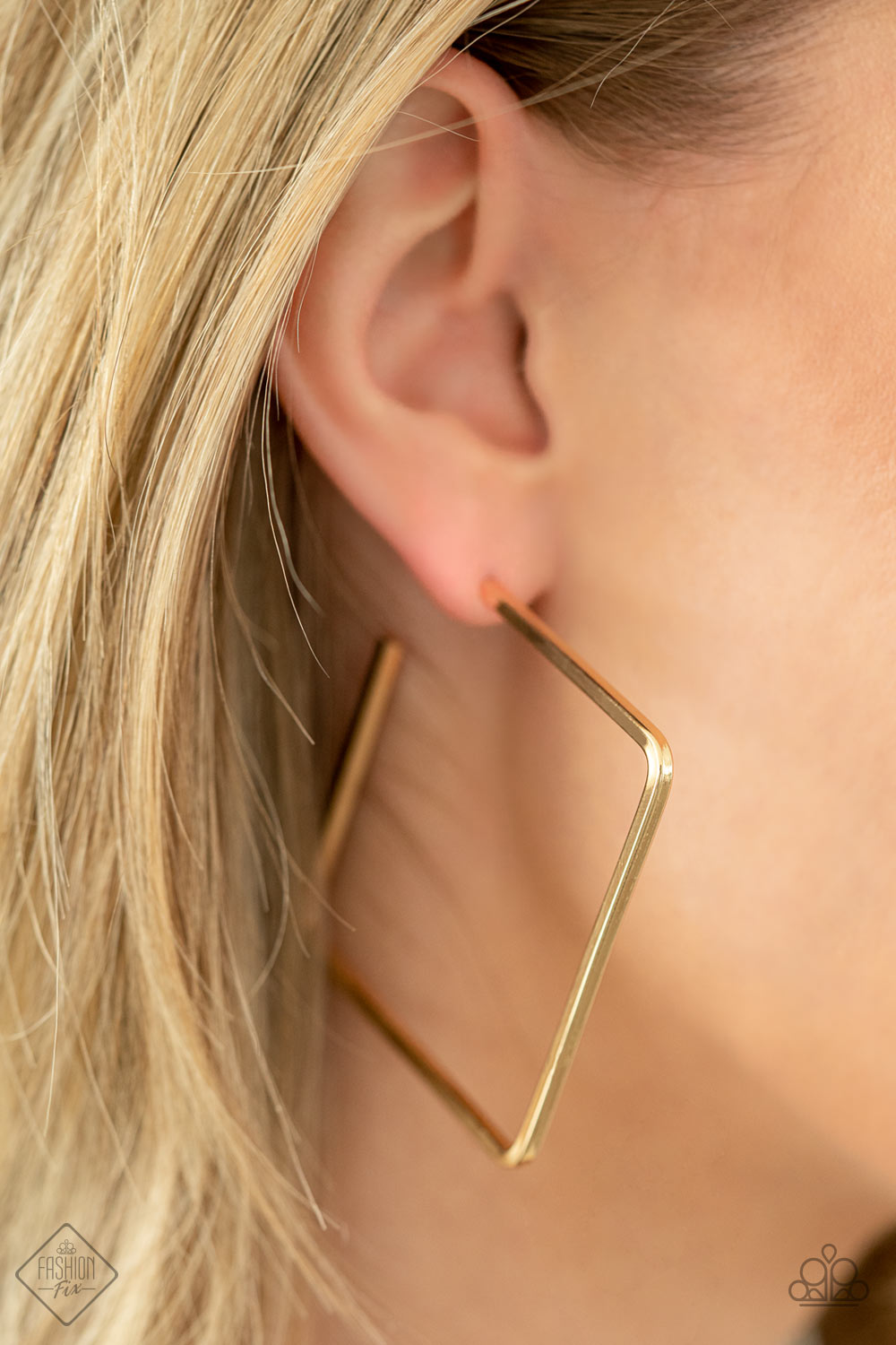 Material Girl Magic - Gold Square Hoop Earrings - Paparazzi Accessories - Simple square frame is tilted on point to create a geometric hoop. Its sharp angles are complemented by its rich gold finish, making a lasting impression. Earring attaches to a standard post fitting. Hoop measures approximately 2" in diameter. Sold as one pair of hoop earrings.