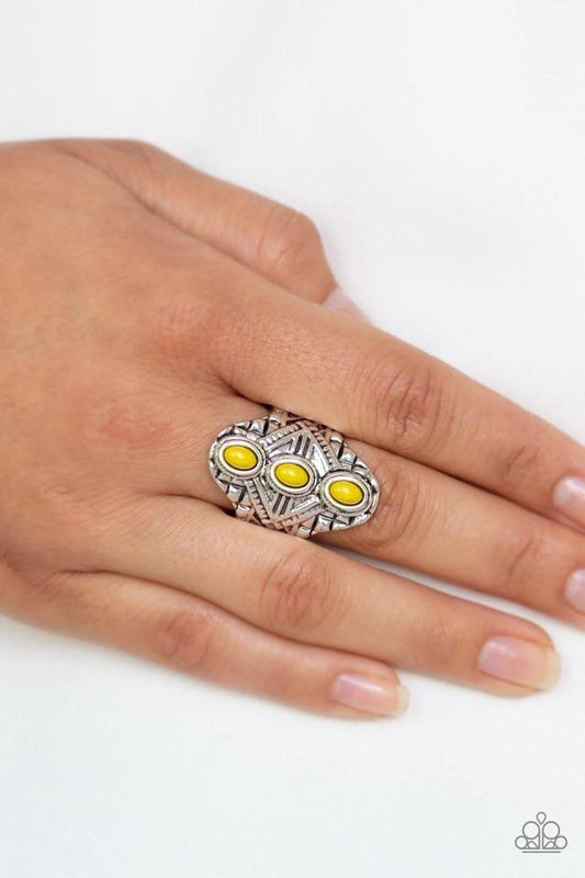 Mayan Motif - Yellow and Silver Ring - Paparazzi Accessories - Three dainty yellow beads stack along the center of an ornate silver frame embossed in shimmery geometric patterns for a bold tribal fashion ring. Features a stretchy band for a flexible fit. Sold as one individual ring.