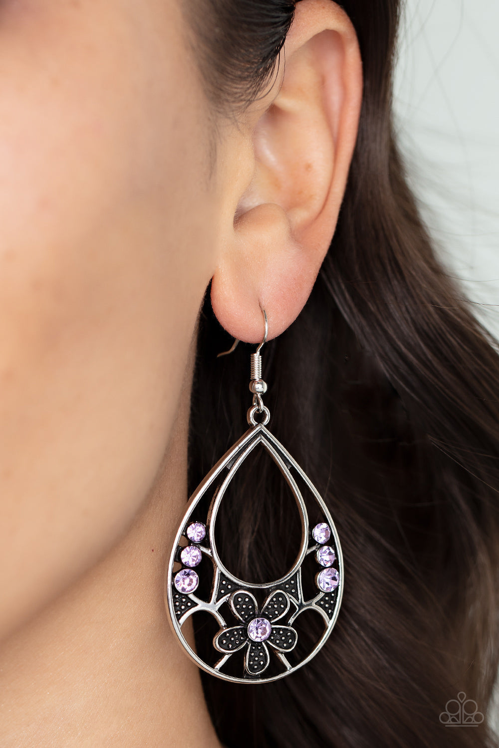 Meadow Marvel - Purple and Silver - Floral Earrings - Paparazzi Accessories - Dainty purple rhinestones and floral pattern blooms inside an airy teardrop frame. Earring attaches to a standard fishhook fitting. Sold as one pair of fashion earrings.