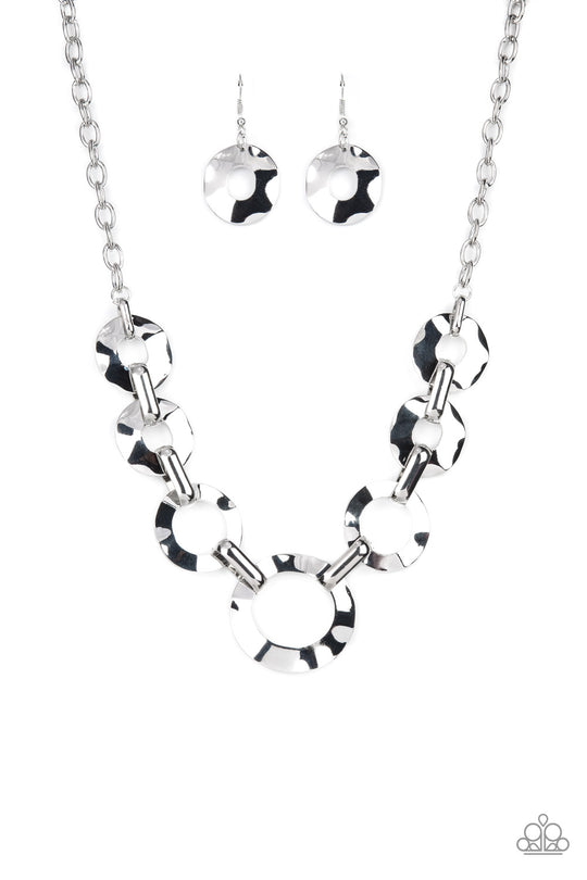 Mechanical Masterpiece - Silver Necklace - Paparazzi Accessories - Featuring hammered surfaces, crinkled silver rings gradually increase in size as they alternate with bold silver fittings below the collar for an intense industrial fashion. Features an adjustable clasp closure. Sold as one individual necklace.