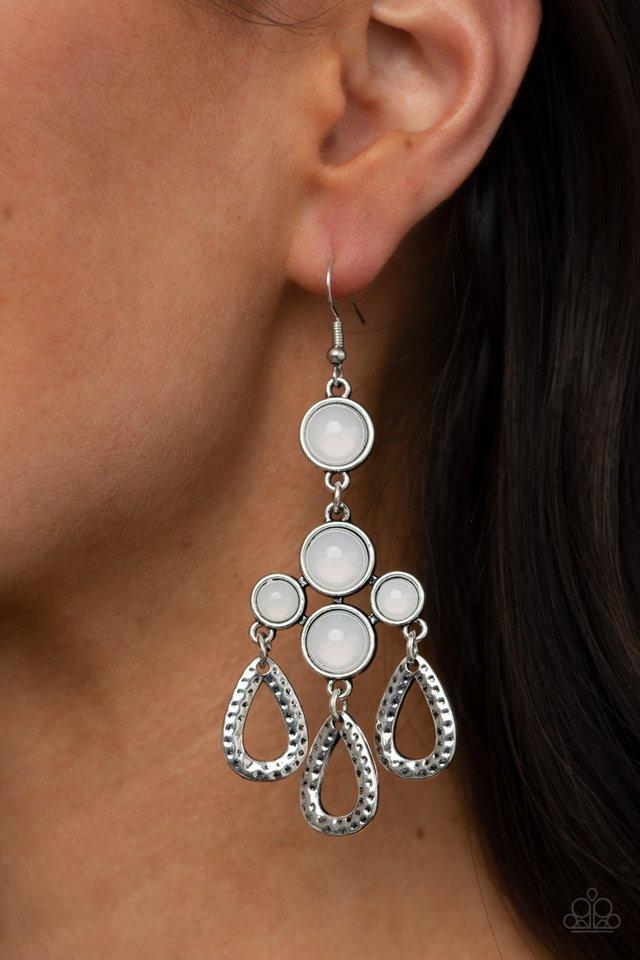 Mediterranean Magic - White and Silver Fashion Earrings - Paparazzi Accessories - A cluster of bubbly opalescent beaded frames give way to hammered silver teardrops, creating a mystical fringe. Earring attaches to a standard fishhook fitting. Sold as a pair of fashion earrings.