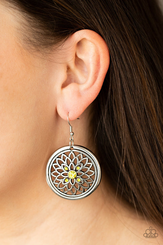 Mega Medallions - Yellow and Silver Earrings - Paparazzi Accessories - Dotted with a glittery yellow rhinestone center, airy silver petals bloom across the front of a rustic silver hoop, creating a sparkly medallion-like frame. Earring attaches to a standard fishhook fitting. Sold as one pair of earrings.