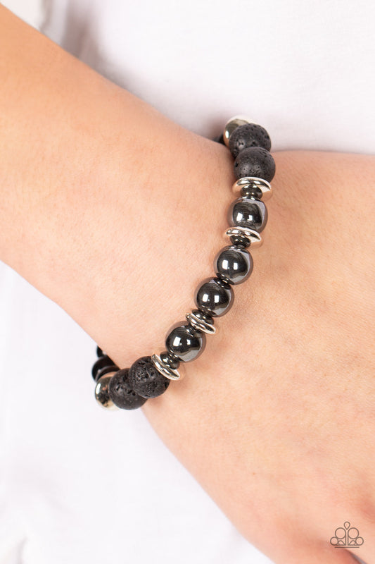 Mega Metamorphic - Black Lava Rock - Gunmetal Bead Stretchy Bracelet - Paparazzi Accessories - Infused with a section of polished black beads, a stellar assortment of gunmetal beads, silver accents, and black lava rock beads are threaded along stretchy bands around the wrist for an urban flair.  Bejeweled Accessories By Kristie - Trendy fashion jewelry for everyone -