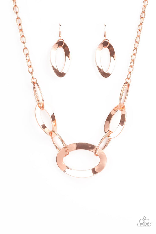 METALHEAD Count - Copper Fashion Necklace - Paparazzi Jewelry - Bejeweled Accessories By Kristie - Flattened shiny copper oval frames link with oval shiny copper rings below the collar, creating a gritty glamorous statement. Features an adjustable clasp closure necklace.