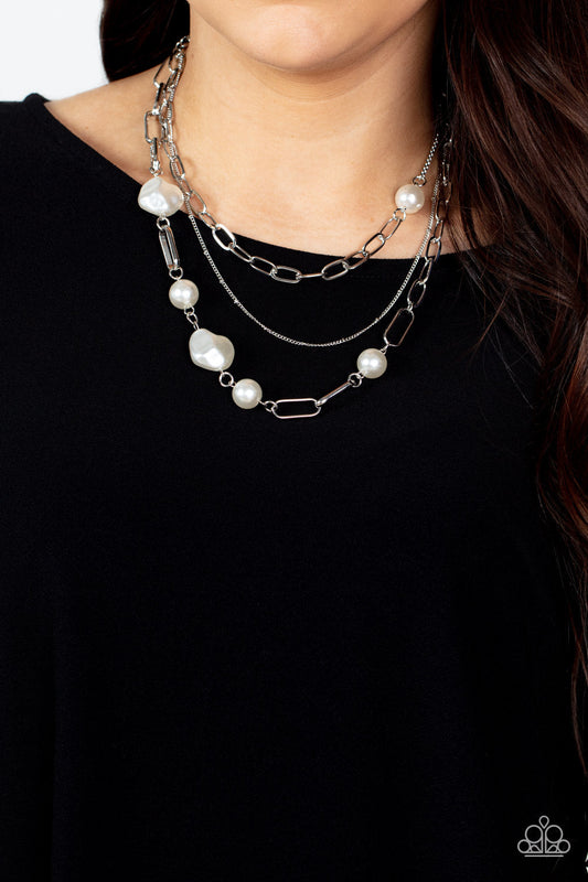 Modern Innovation - White Pearl and Silver Necklace - Paparazzi Accessories - Round and imperfectly faceted white pearls adorn an assortment of mismatched chunky and dainty silver chains, for an edgy refinement below the collar. Fashion necklace has an adjustable clasp closure.