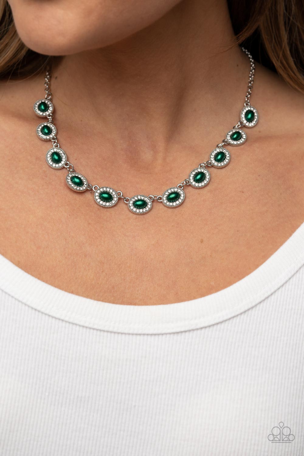 Modest Masterpiece - Green Pearl Necklace - Paparazzi Accessories - Encased in rings of glassy white rhinestones, oval Leprechaun pearl dotted frames delicately link into a twinkly display below the collar for a timeless fashion. Features an adjustable clasp closure. Sold as one individual necklace.