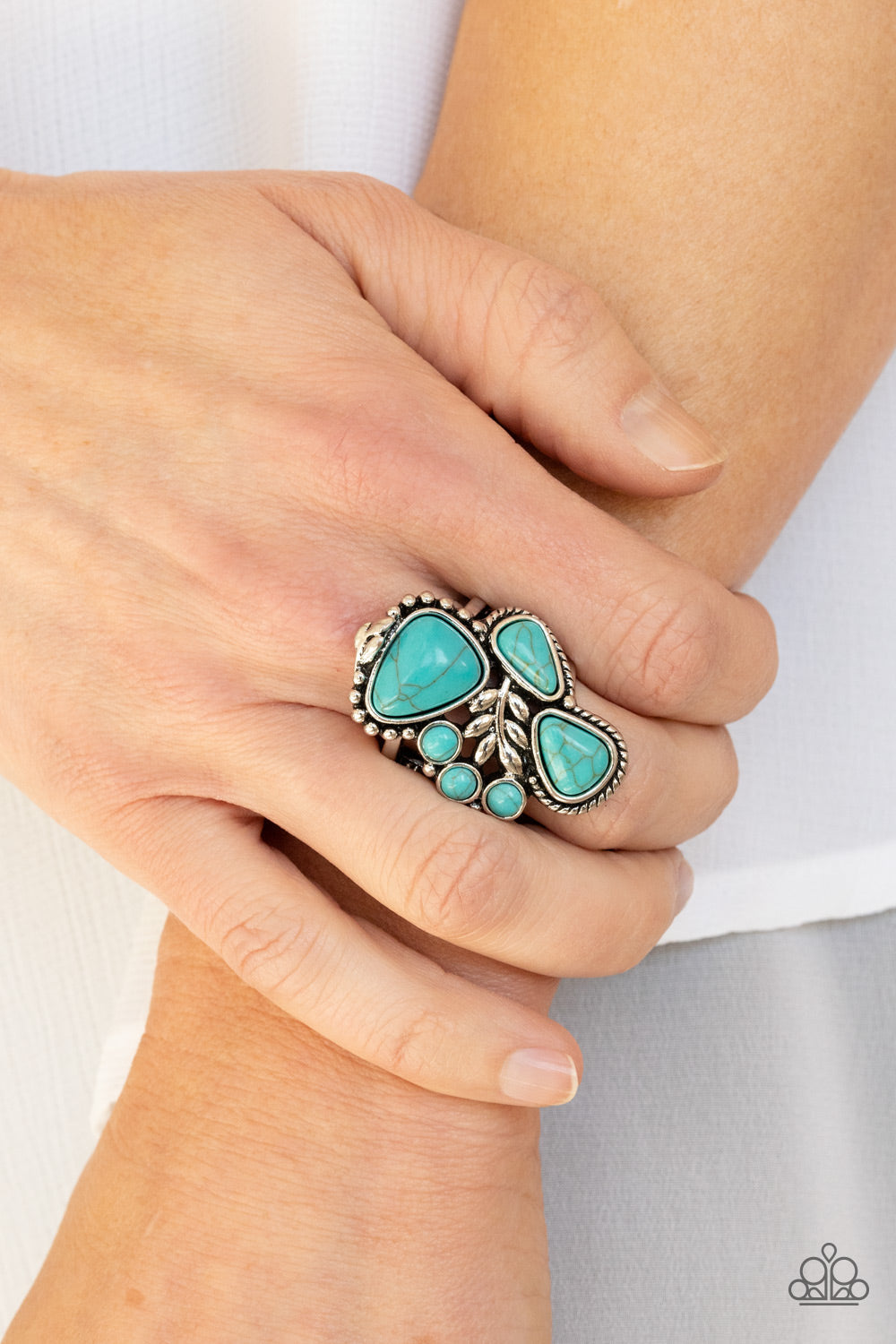 Mystical Mesa - Blue Turquoise - Silver Ring - Paparazzi Accessories - Round and teardrop shapes, a refreshing collection of turquoise stones gather around a leafy silver accent, creating a whimsical center atop the finger. Features a stretchy band for a flexible fit.