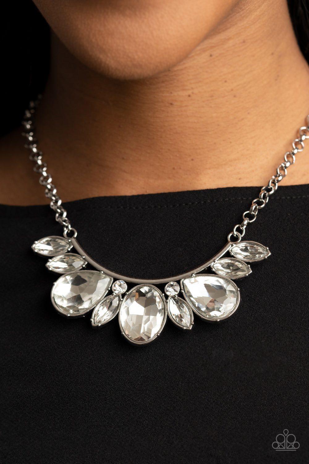 Never SLAY Never - White and Silver Necklace - Paparazzi Accessories - An oversized collection of round, marquise, and teardrop white rhinestones drip from the bottom of a bowing silver bar, coalescing into a sassy statement piece below the collar. Features an adjustable clasp closure.