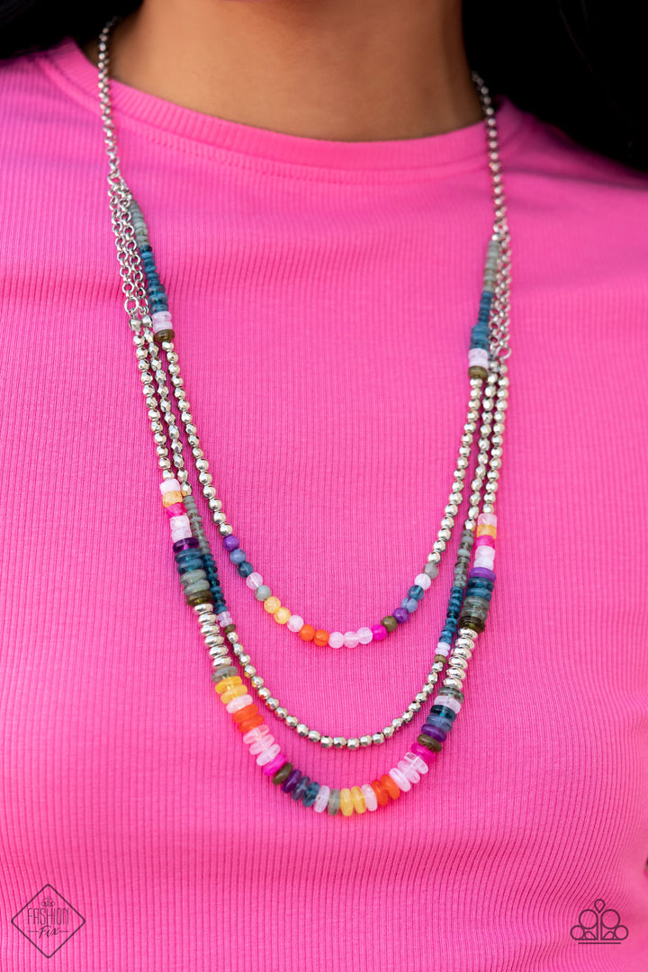 Newly Neverland - Multi Color and Silver Necklace - Paparazzi Accessories - Silver beads combine with a collection of solid, milky, and cloudy beads in varying sizes and colors, to create a playful trio of silver layers down the chest. Featured in colors of Waterspout, Loden Frost, white, purple, fuchsia, baby pink, Orange Tiger, Samoan Sun, Midnight, and Martini Olive, the beads create a youthful and energetic impression that will never grow up, as the colorful layers connect to an elongated silver chain.