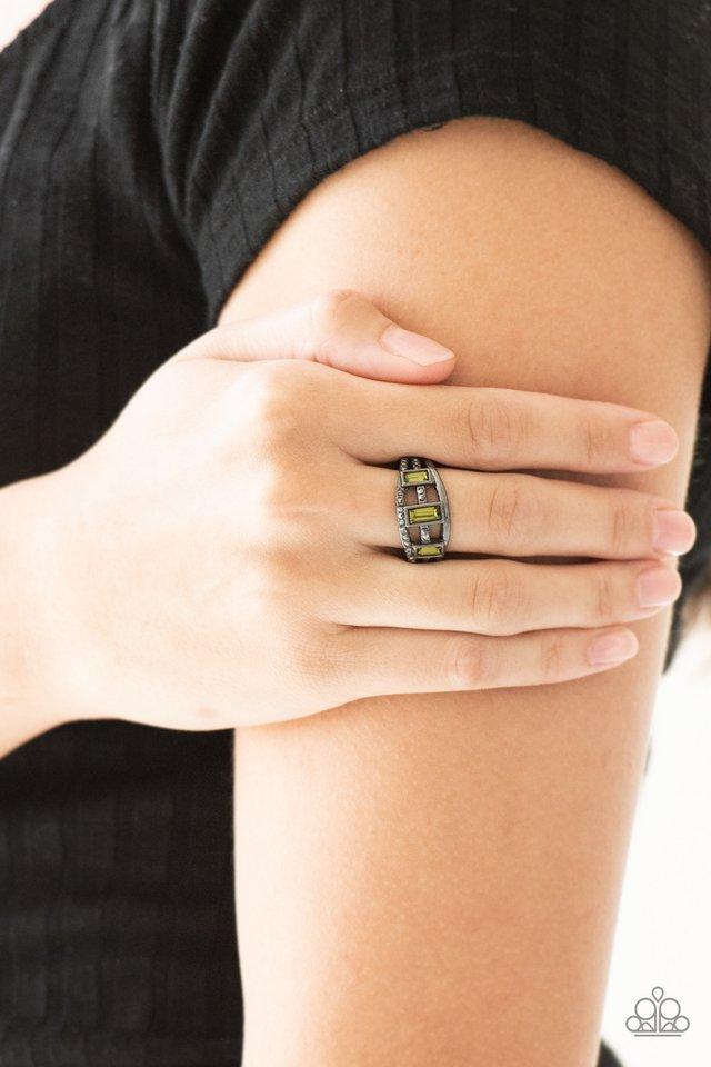 Noble Nova - Green and Black Metal Ring - Paparazzi Accessories - Three green emerald-cut rhinestones are encrusted along three gunmetal bands radiating with smooth surfaces and sections of glittery hematite rhinestones for an edgy fashion ring.