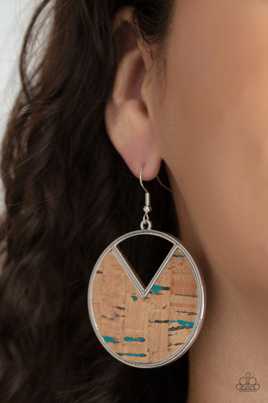 Nod to Nature - Blue and Brown Cork Earrings - Paparazzi Accessories - Blue accents and an earthy piece of cork is placed into the center of a circular hoop. A triangular slice is removed from the cork, creating an edgy stylish earrings. Earring attaches to a standard fishhook fitting.