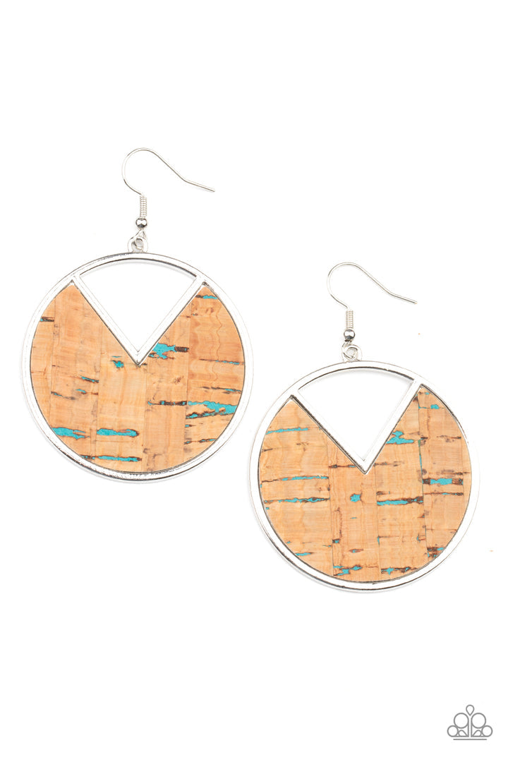 Nod to Nature - Blue and Brown Cork Earrings - Paparazzi Accessories - Blue accents and an earthy piece of cork is placed into the center of a circular hoop. A triangular slice is removed from the cork, creating an edgy stylish earrings. Earring attaches to a standard fishhook fitting. Bejeweled Accessories By Kristie - Trendy fashion jewelry for everyone -