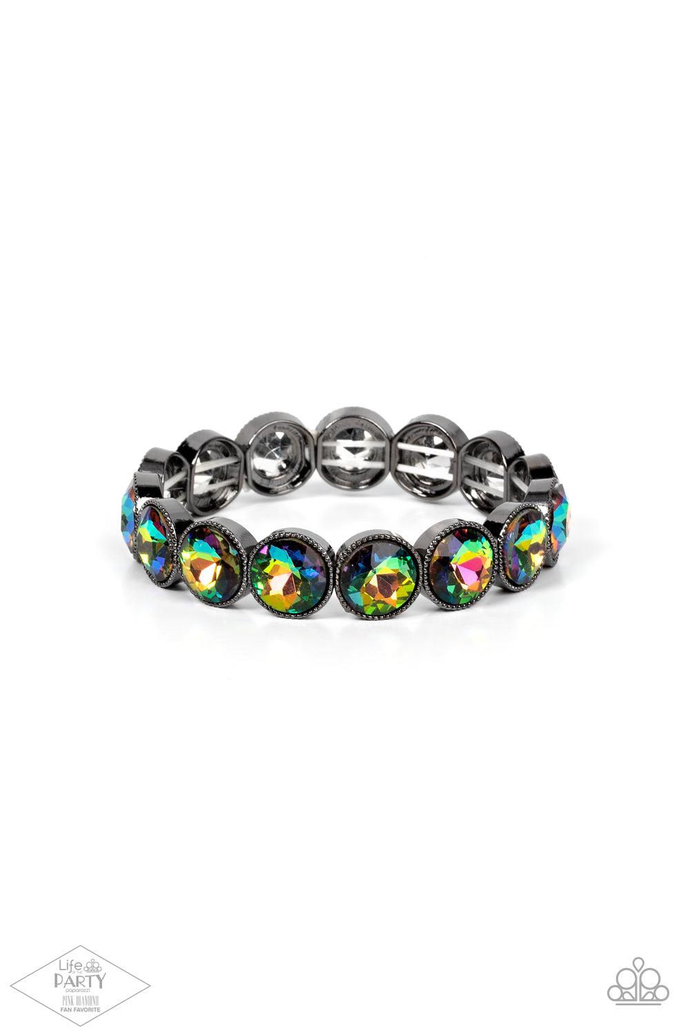 Number One Knockout - Multi Oil Spill Rhinestone Bracelet - Paparazzi Accessories - Oil spill gems are pressed into sleek gunmetal frames. The glittery frames are threaded along stretchy bands, creating a glamorous look around the wrist.