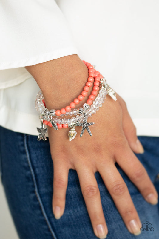 Ocean Breeze - Orange and Silver Bracelet - Paparazzi Accessories - A collection of polished coral and glassy crystal-like beads are threaded along stretchy bands, creating colorful layers across the wrist. Infused with ornate silver beads, an assortment of decorative starfish, floral charms, and dainty sea shells swing from the beaded strands for a summery finish. Sold as one set of four bracelets.