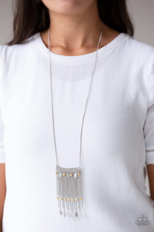 On The Fly - Yellow and Silver Necklace - Paparazzi Accessories - Attached to a lengthened silver chain, a hammered silver bar gives way to a fringe of shimmery silver chain, yellow stone beads, and silver feather frames for a seasonal look.
