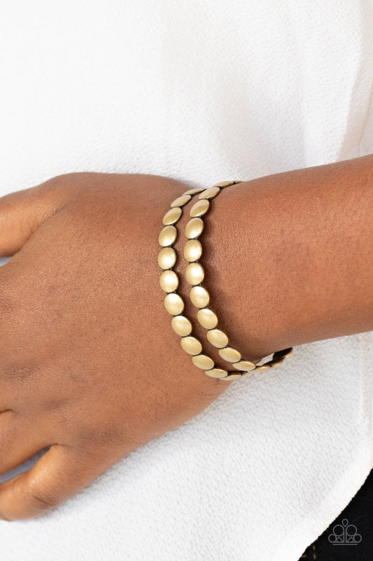On The Spot Shimmer - Brass Cuff Bracelet - Paparazzi Accessories - 
Brushed in an antiqued finish, rows of flattened brass studs coalesce into a rustic cuff around the wrist. Sold as one individual bracelet.
