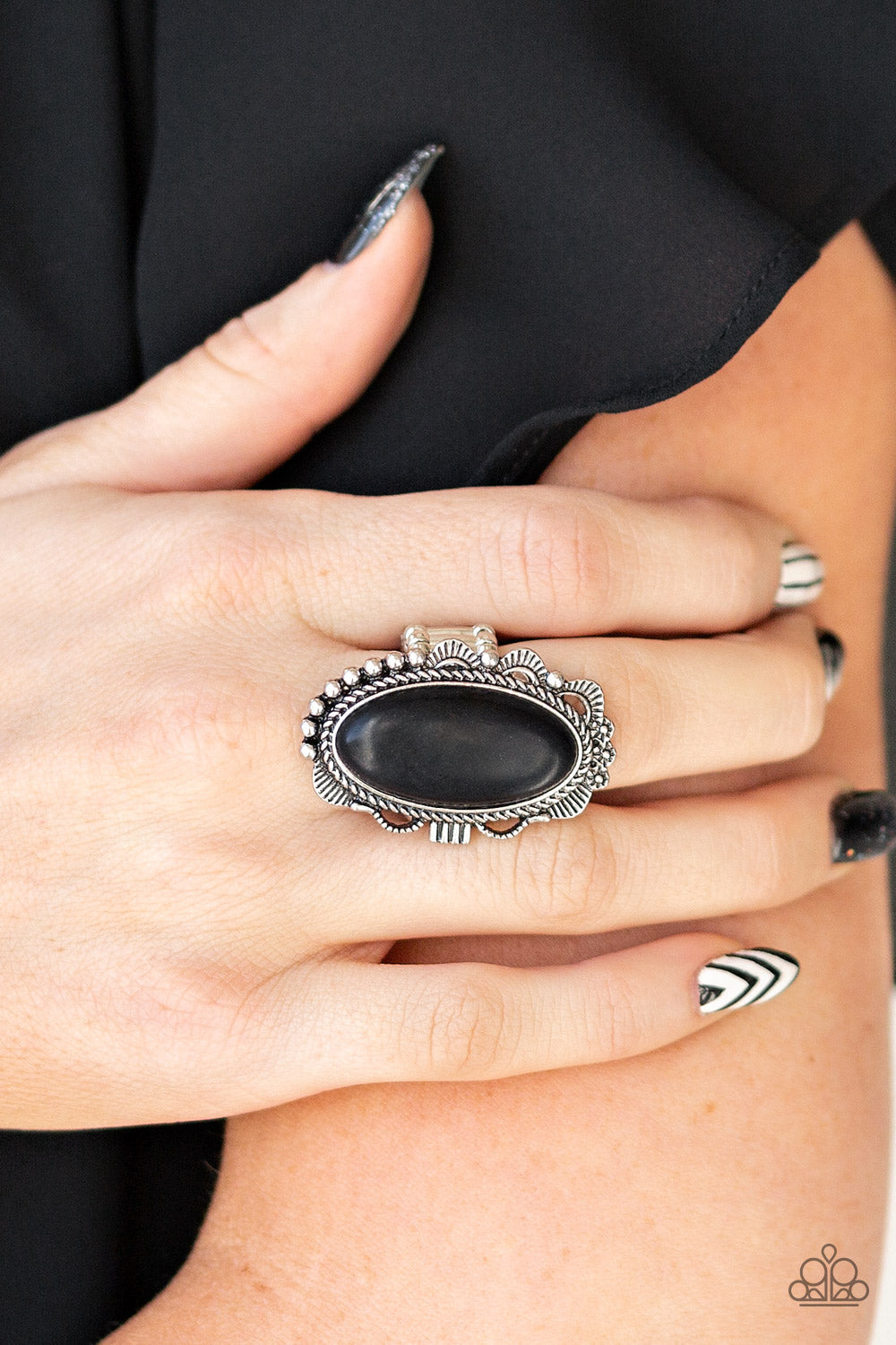 Open Range - Black and Silver - Stone Ring - Paparazzi Accessories - An earthy black stone is pressed into an ornate silver frame rippling with studded and serrated textures for a seasonal flair. Features a stretchy band for a flexible fit. Sold as one individual ring.