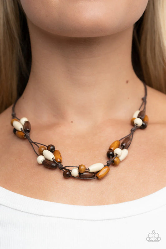 Outback Epic - Brown Necklace - Paparazzi Accessories - Mismatched clusters of brown, white, and dark brown wooden beads are knotted in place along shiny brown cords below the collar for an earthy flair. Features a button loop closure. Sold as one individual necklace.