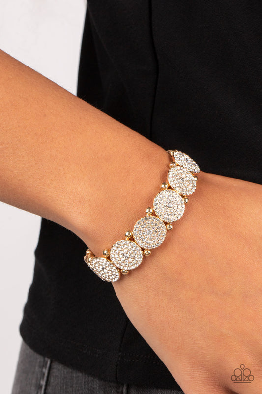 Palace Intrigue - Gold Rhinestone Stretchy Fashion Bracelet - Paparazzi Accessories - Icy white rhinestone encrusted gold frames glitter along stretchy bands around the wrist for a timeless twinkle fashion bracelet.
