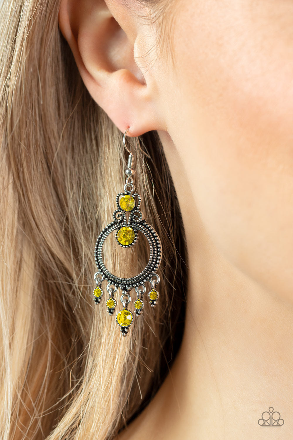 Palace Politics - Yellow Earrings - Paparazzi Accessories - Sparkling with a pair of brilliant yellow rhinestones, a studded filigree accent attaches to the top of a studded silver hoop brimming with antiqued textures. A dainty collection of yellow rhinestones twinkles from the bottom of the frame, resulting in a glittery fringe. Earring attaches to a standard fishhook fitting. Sold as one pair of earrings.