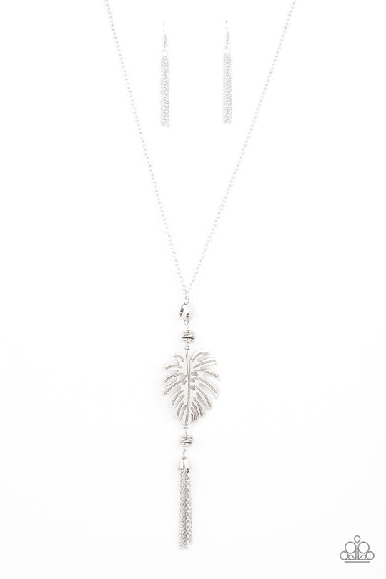 Palm Promenade - Silver Palm Leaf Necklace - Paparazzi Accessories - A lifelike silver palm leaf frame attaches to the bottom of a shimmery silver chain. A silver chain tassel swings from the bottom of this statement fashion necklace. Bejeweled Accessories By Kristie - Trendy fashion jewelry for everyone -
