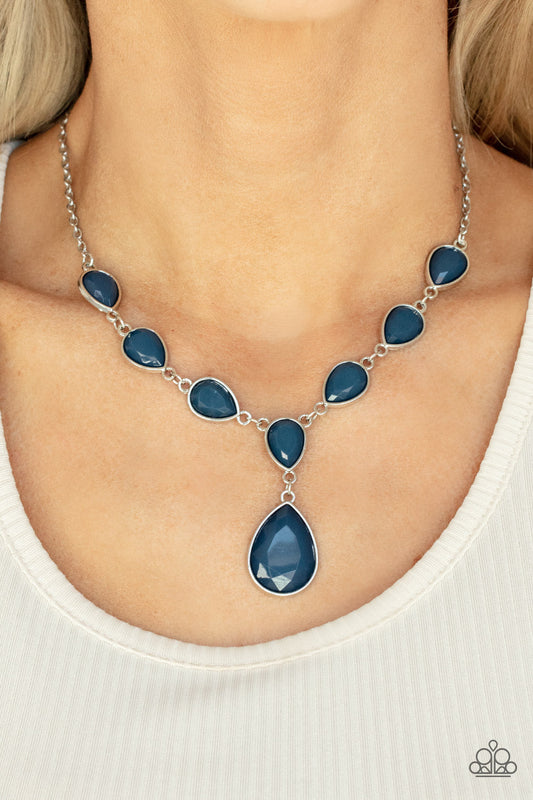 Party Paradise - Blue and Silver Necklace - Paparazzi Accessories - A silver chain of blue teardrops gives way to an oversized blue teardrop pendant for an enchanting pop of color below the collar. Features an adjustable clasp closure.