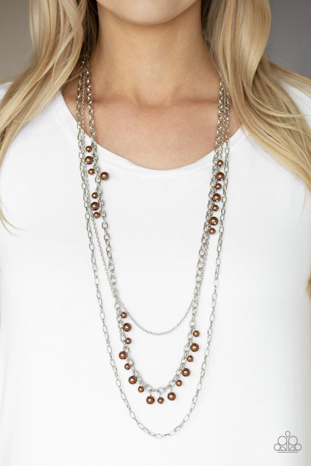 Pearl Pageant - Brown and Silver Necklace - Paparazzi Accessories - Three mismatched silver chains layer down the chest. Dainty brown pearls cascade down one silver chain. Trendy fashion jewelry for everyone.