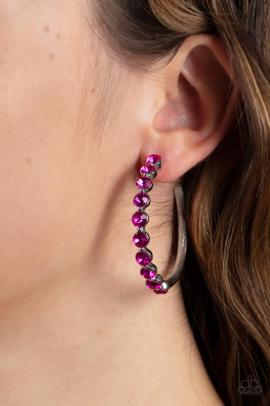 Photo Finish - Pink Bling - Silver Hoop Earrings - Paparazzi Accessories - The front of a bold silver hoop is encrusted in flamboyant Fuchsia Fedora rhinestones, creating a glamorous pop of sparkle. Earring attaches to a standard post fitting. Hoop measures approximately 1 3/4" in diameter.