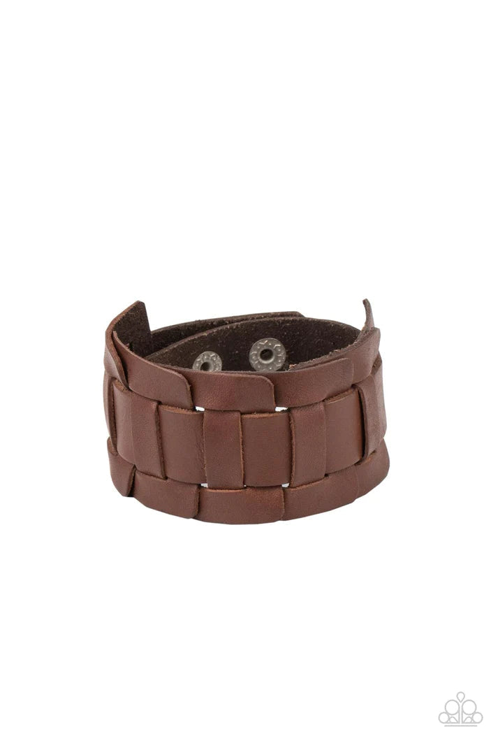 Plainly Plaited - Brown Urban Paparazzi Accessories - A brown leather band is threaded through the center of interlocking square leather links, creating a plaited pattern around the wrist. Features an adjustable snap closure.