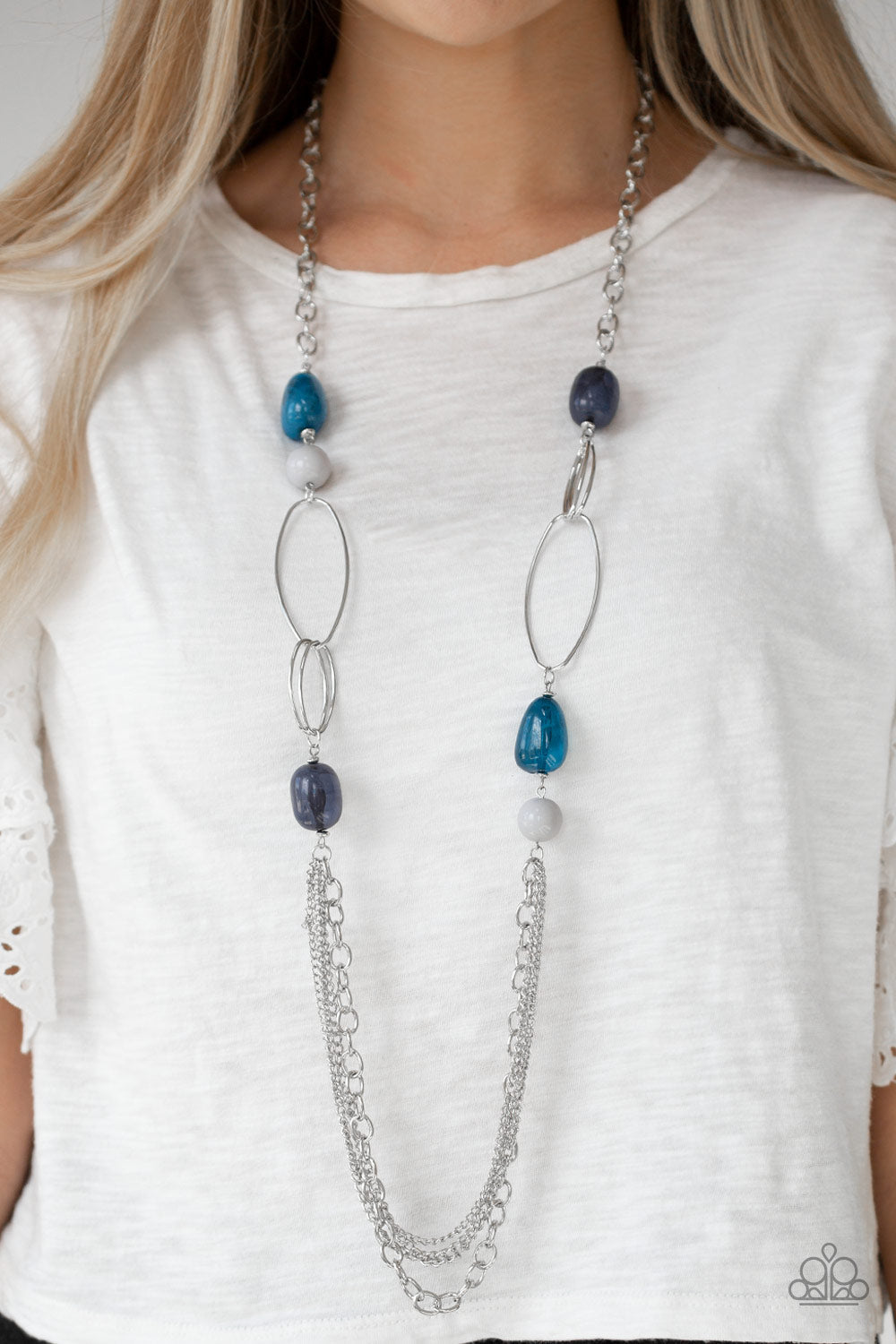 Pleasant Promenade - Multi Blue and Silver Necklace - Paparazzi Accessories - Polished and cloudy faux rock finishes, gray and blue beads link with bold silver hoops. The whimsical compilation gives way to layers of mismatched silver chains for a seasonal finish. Features an adjustable clasp closure necklace.