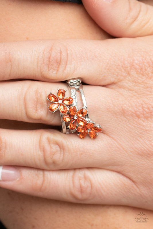 Posh Petals - Orange Floral - Silver Fashion Ring - Paparazzi Accessories - Dotted with dainty white rhinestone centers, orange rhinestone petaled floral frames slant across layers of plain silver and white rhinestone encrusted silver bands for a sparkly efflorescence. Features a stretchy band for a flexible fit.  Sold as one individual ring. Bejeweled Accessories By Kristie - Trendy fashion jewelry for everyone -