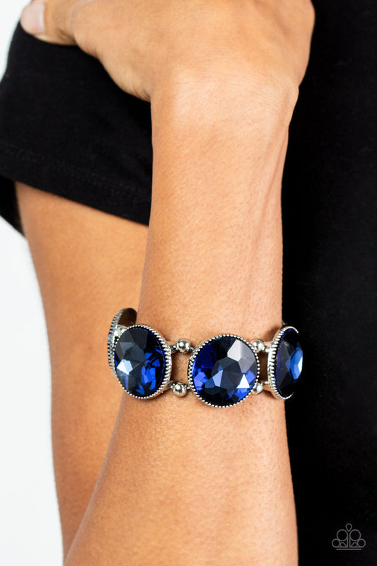 Powerhouse Hustle - Blue and Silver Stretchy Bracelet - Paparazzi Accessories - A glitzy collection of dramatically oversized Rhodonite blue rhinestone frames are threaded along stretchy bands around the wrist for a jaw-dropping dazzle. Sold as one individual bracelet. 