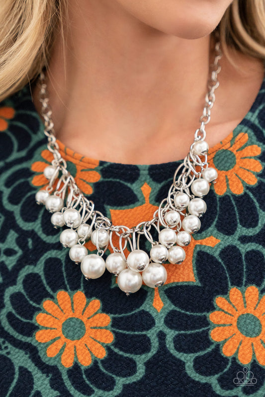 Powerhouse Pose - White Pearl - Silver Necklace - Paparazzi Accessories - Oversized white pearls dance from the bottoms of shiny silver ovals that cluster along a chunky silver chain, for a luxurious fringe below the collar. Necklace has an adjustable clasp closure.